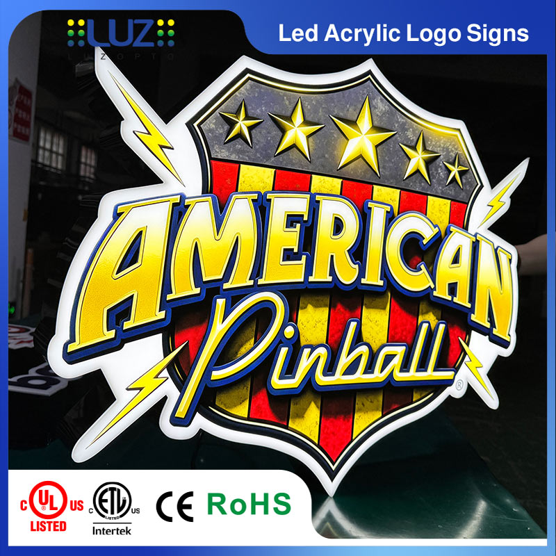 Multiple custom LED acrylic logo signs produced in workshop with UL and ETL certified components.